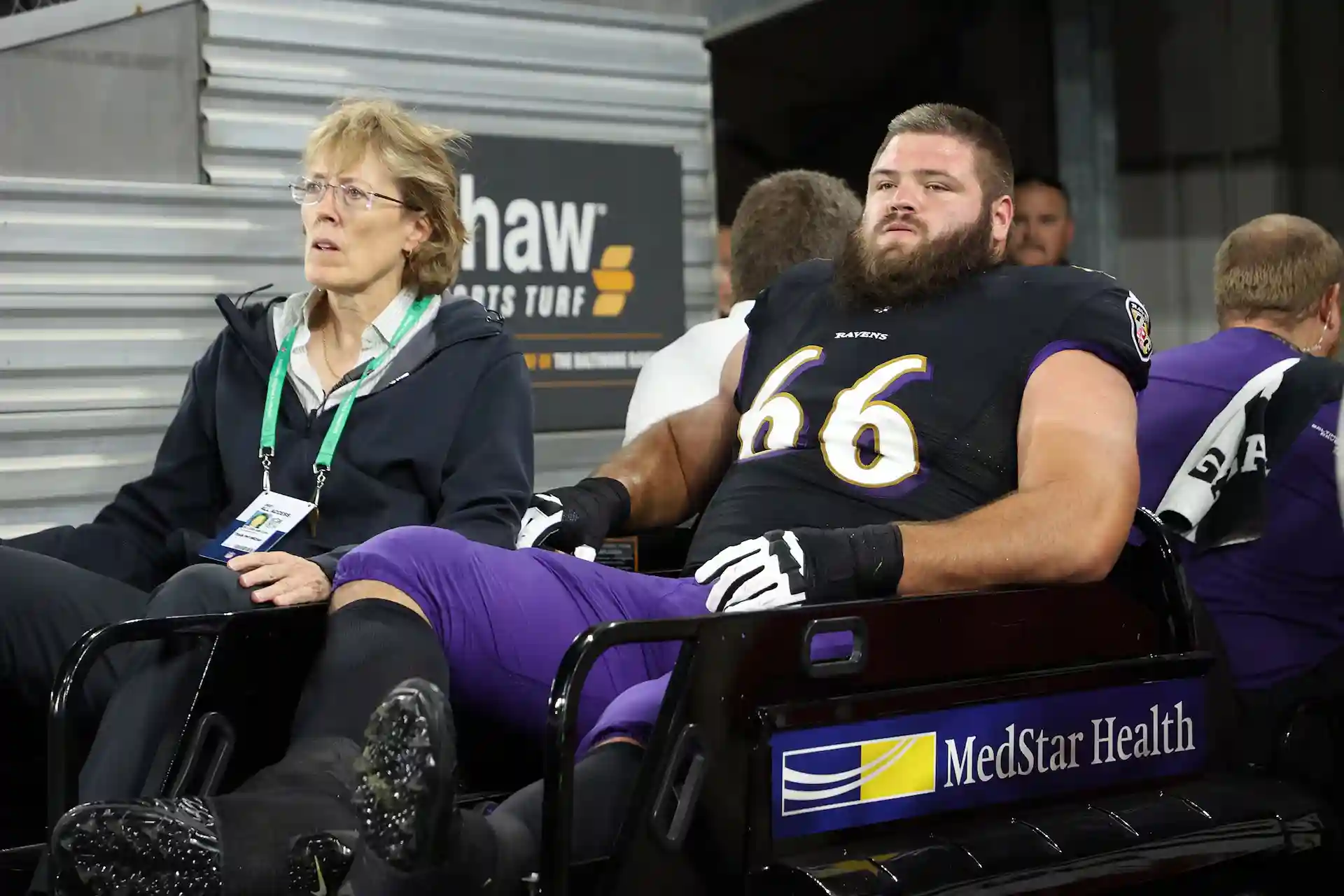 Ben Cleveland being carted off the field after injury during a Baltimore Ravens game