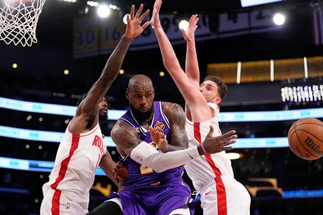 LeBron James drives past Rockets defenders in Lakers vs Rockets playoff game