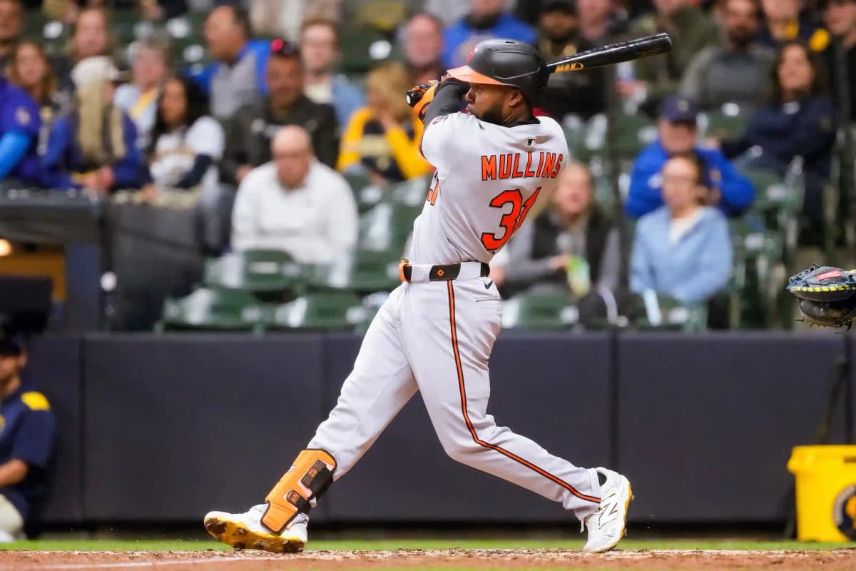 Cedric Mullins swinging during an at-bat in a major league baseball game