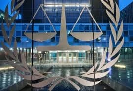 International Criminal Court emblem displayed on a glass facade at the ICC headquarters in The Hague.